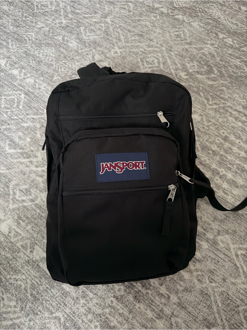 Jansport Black Backpack with Navy Logo Patch